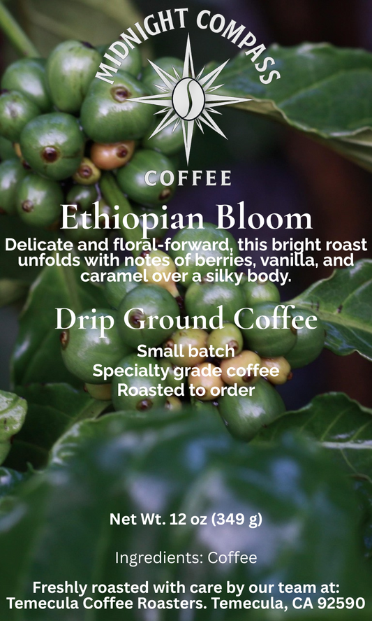 Midnight Compass Coffee: Ethiopian Bloom - Delicate and floral-forward, this bright roast unfolds with notes of berries, vanilla, and caramel over a silky body.